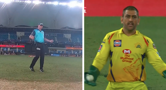 Dhoni makes an angry gesture while on field umpire Paul Reiffel attempts to signal a wide.