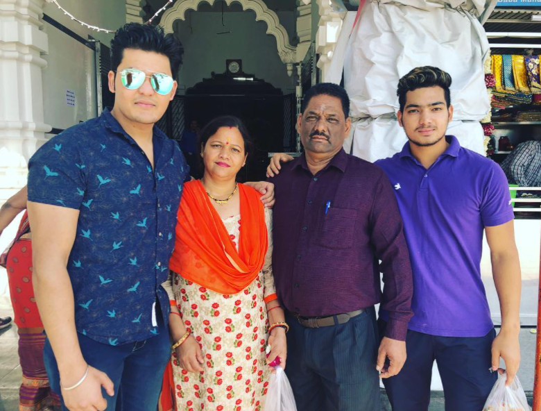 Anuj Rawat with his mother, father and brother